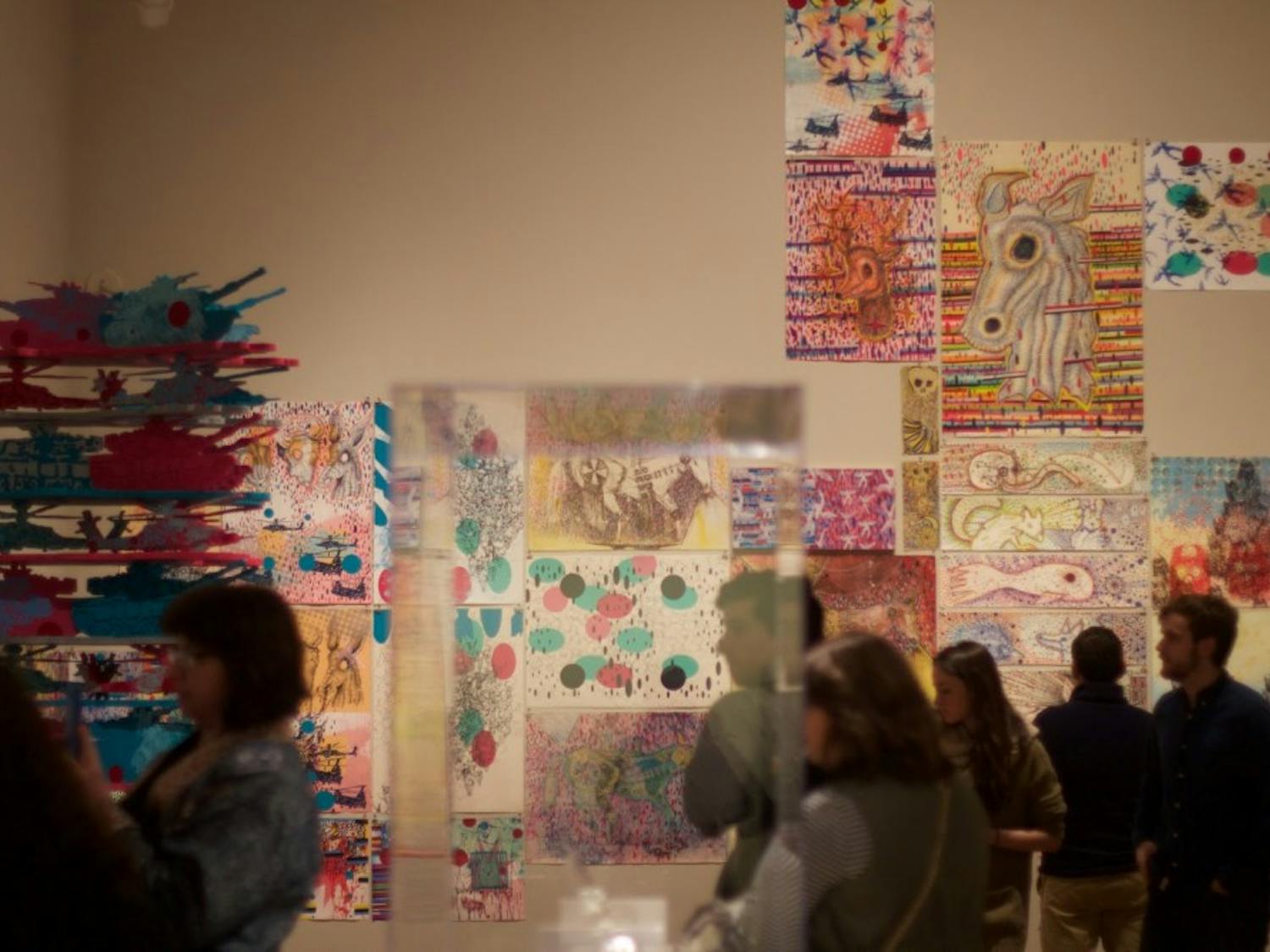 The public interacts with the exhibition on the night of its opening.