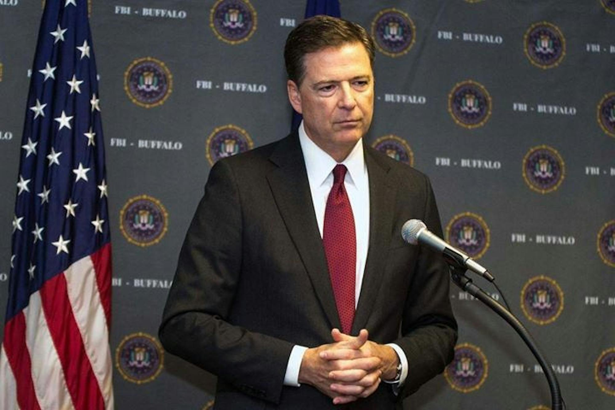 James Comey stares vacantly towards a crowd of onlookers as he’s forced to relive the most harrowing 139 days of his life.