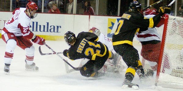 Badgers split with Tigers