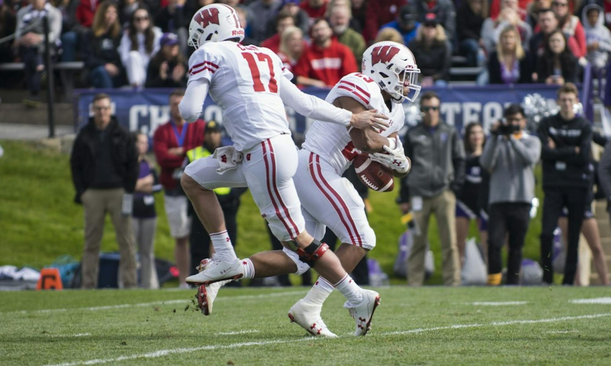 Jack Coan is the favorite to retain the starting job in a crowded quarterback room that includes talented true freshman Grahm Mertz