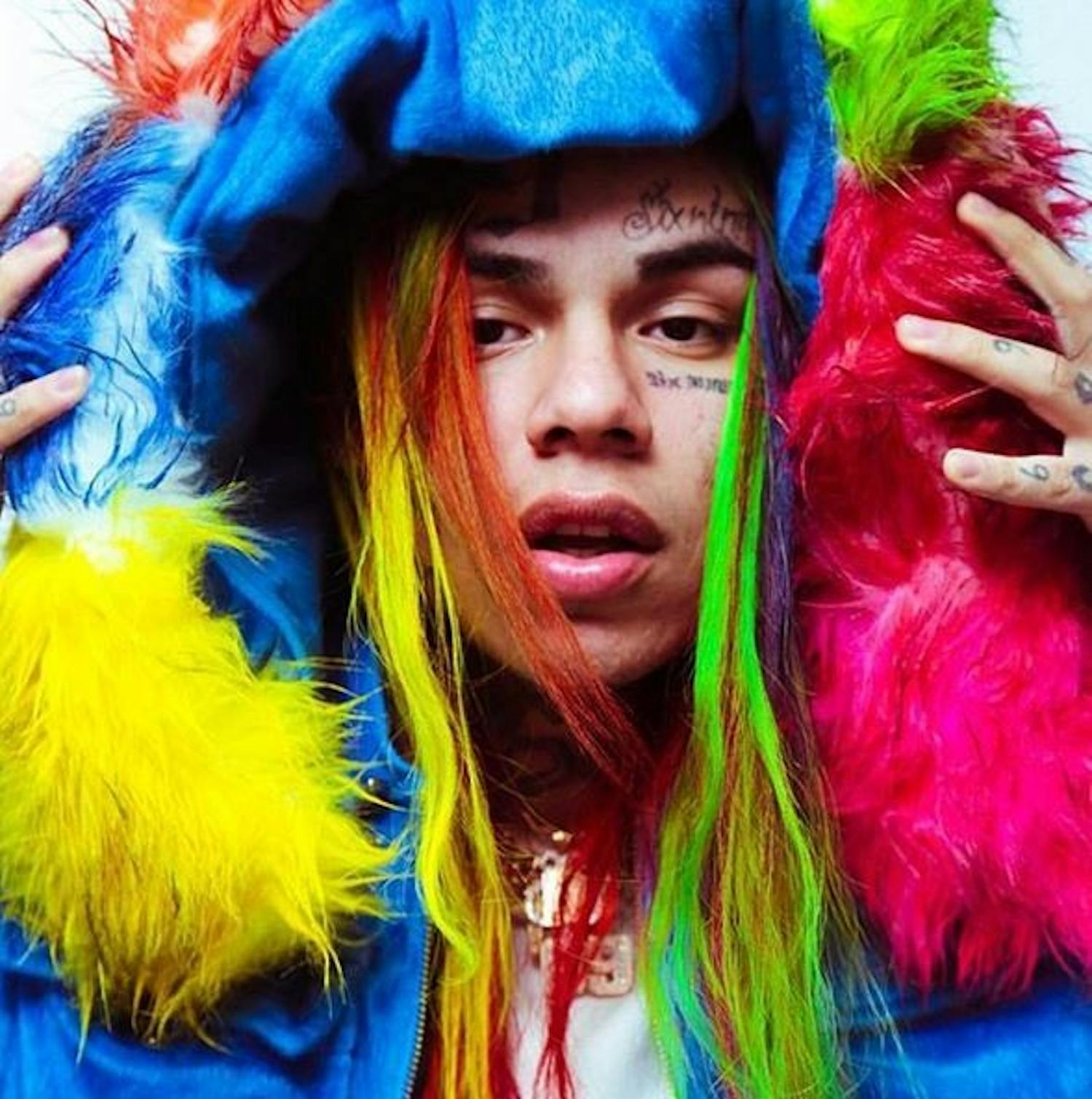 Don't let the bright accents of his eccentric looks fool you &mdash; 6ix9ine has a dark history.