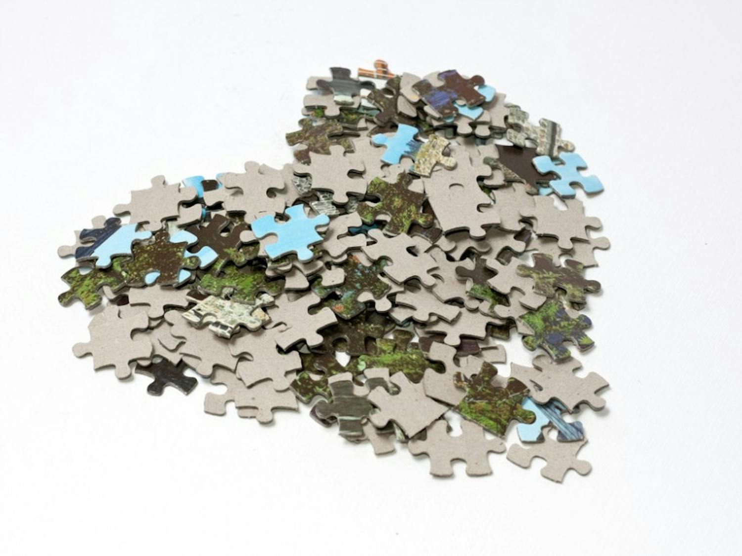 Tilted heart made of lots of jigsaw puzzle pieces