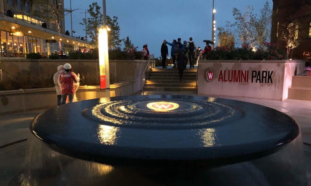 Around a thousand alumni, students and community members gathered for the grand&nbsp;opening of UW-Madison's Alumni Park Friday evening.&nbsp;