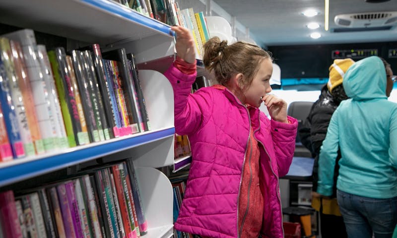 Library on Wheels offers more opportunities for students with limited access to public libraries to check out a book.