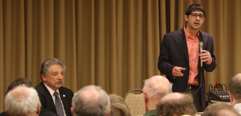 Ald. Scott Resnick (right) and Mayor Paul Soglin (left) debated at the Concourse Hotel Wednesday.