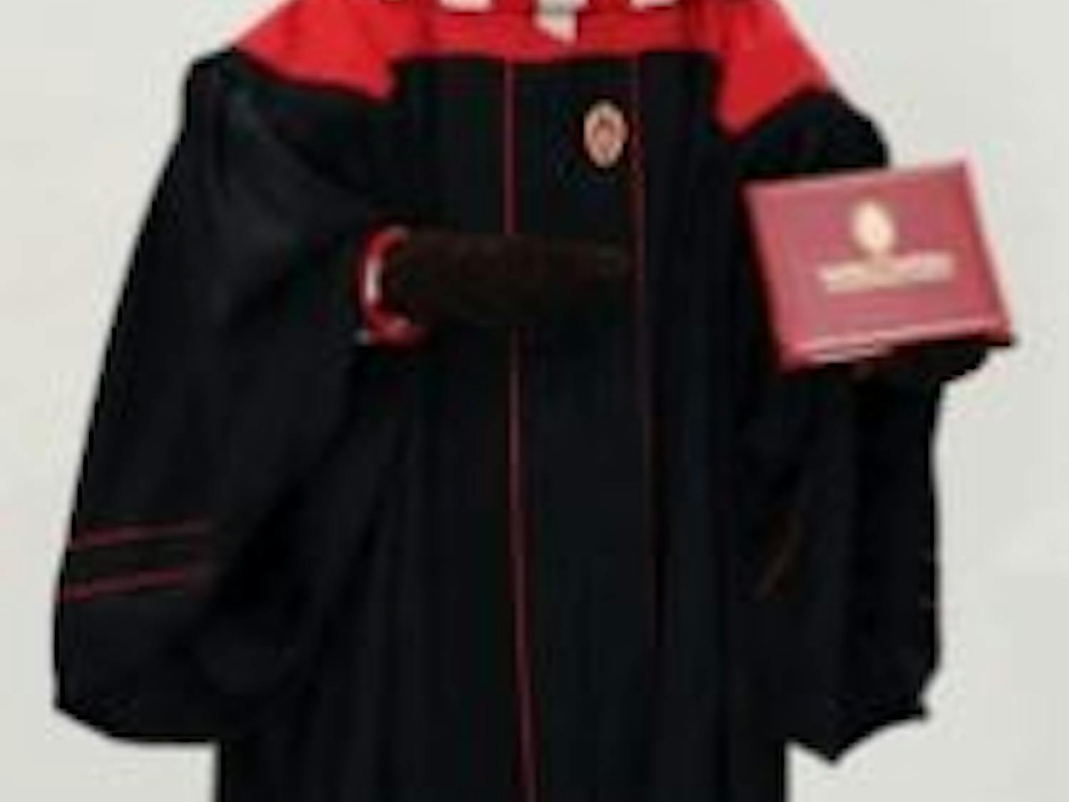 Bucky Badger models the new undergraduate commencement gown.