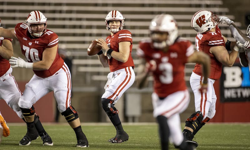 Wisconsin Badgers quarterback Graham Mertz (5) looks for a receiver during an NCAA college football game against the Illinois Fighting Illini Friday, Oct. 23, 2020, in Madison, Wis. The Badgers won 45-7. (Photo by David Stluka/Wisconsin Athletic Communications)