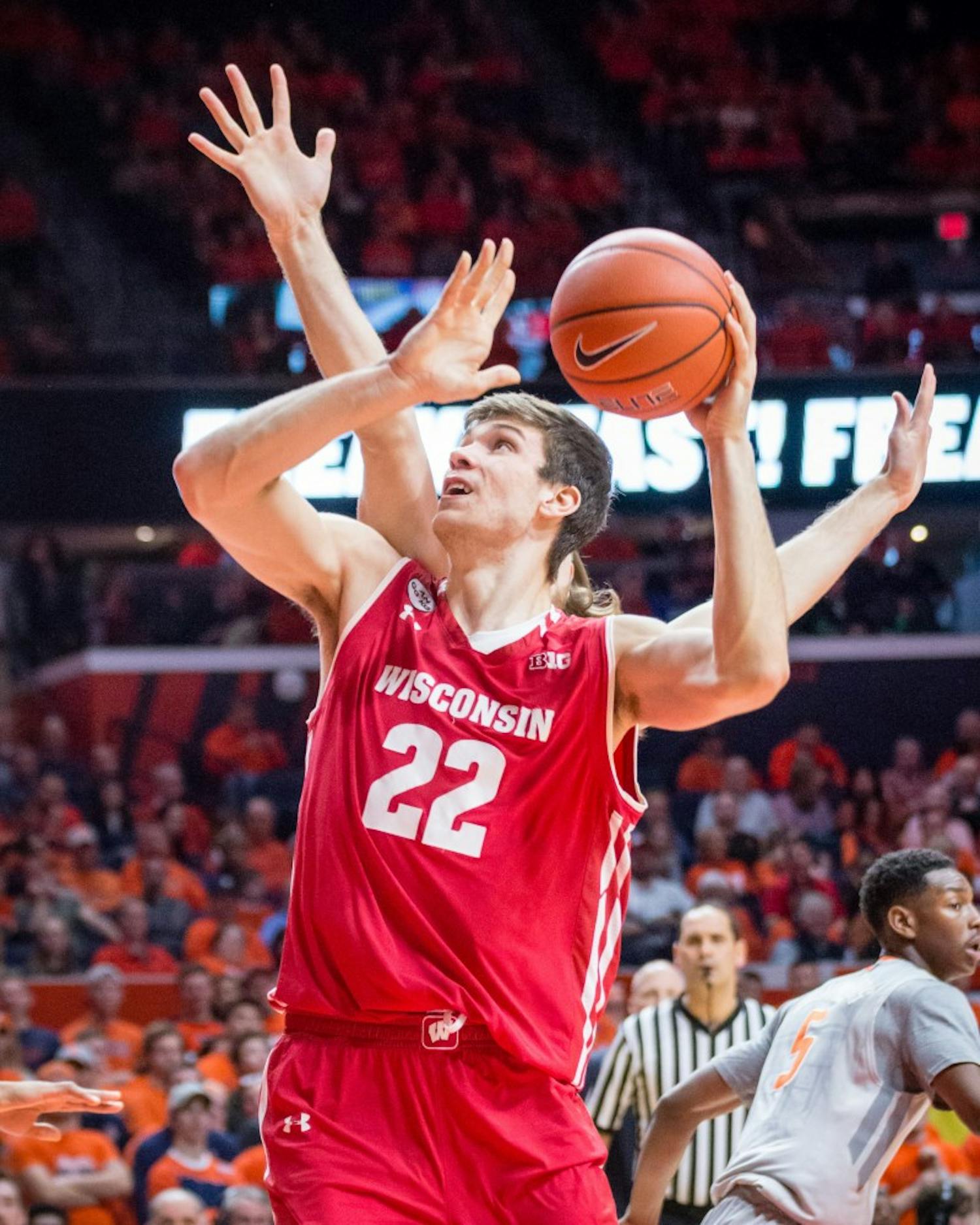 Wisconsin's Ethan Happ (22) goes up for a layup during the game against Illinois at State Farm Center on Tuesday, January 31.