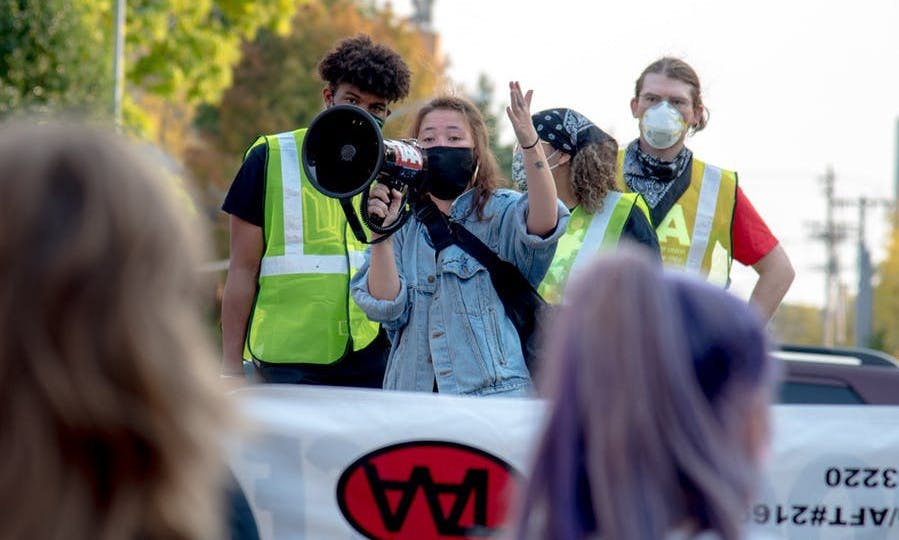 Photo of TAA and BIOPIC members protesting UWPD presence on campus.