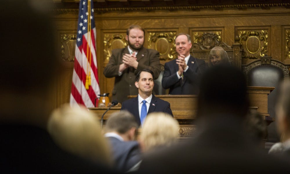 Gov. Scott Walker signed a host of bills into law Tuesday designed to combat child abuse and sex trafficking in Wisconsin.