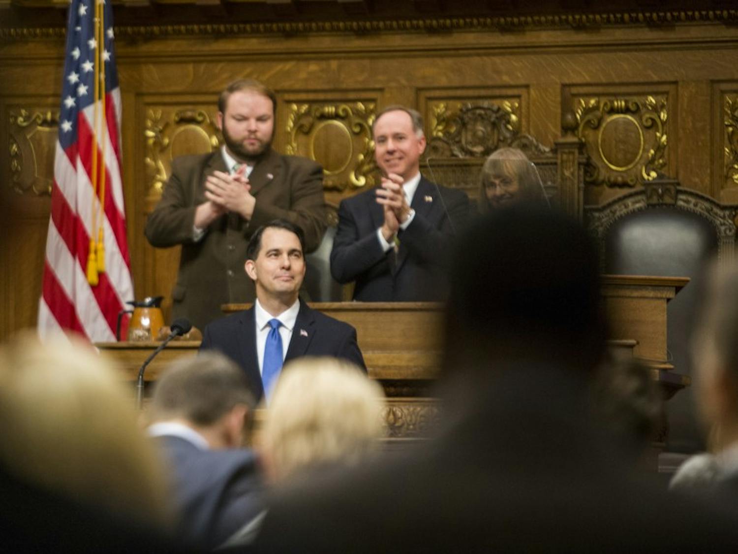 Gov. Scott Walker signed a host of bills into law Tuesday designed to combat child abuse and sex trafficking in Wisconsin.