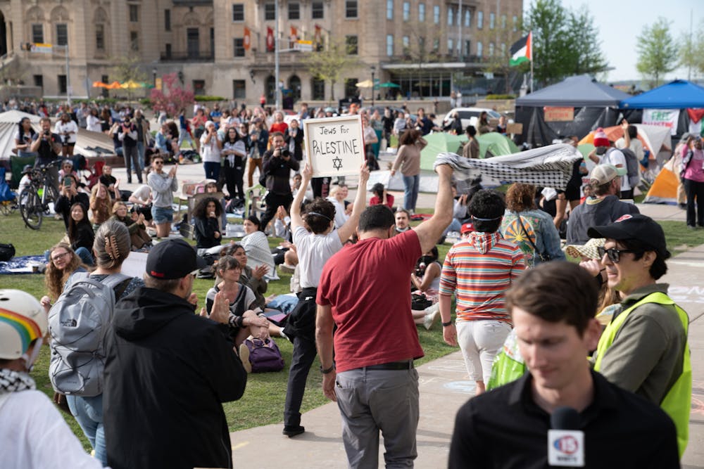 <p>Protesters march in support of Palestine on May 1, 2024 in Madison, Wis.</p>