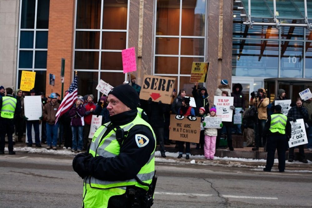 Protesters face Koch office, limitations