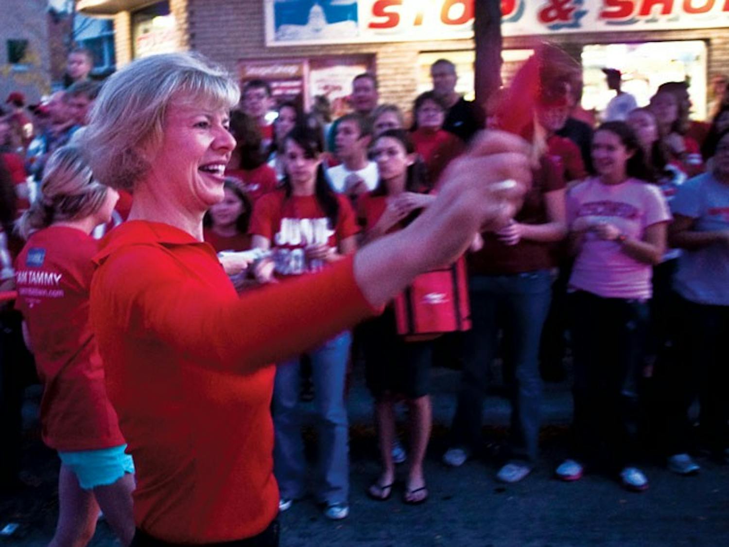 Candidates campaign during Homecoming festivities