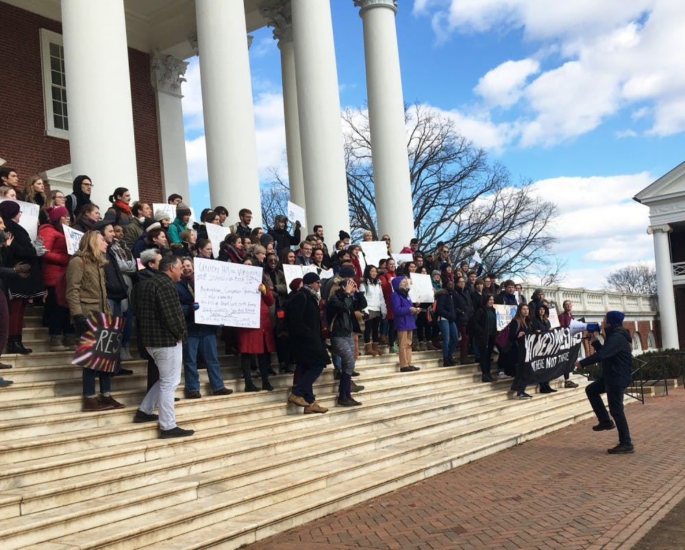 <p>Students, faculty and community members protest Trump's proposed pipeline agenda on the steps of the Rotunda.</p>