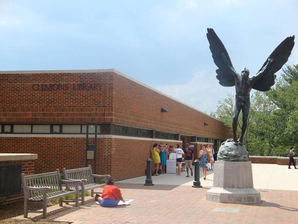 A man allegedly made racial slurs to three students at Clemons Library Tuesday evening.