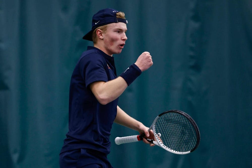 <p>Rice, hat turned backward and arm flexed, reacts to winning a point against Boise State.</p>