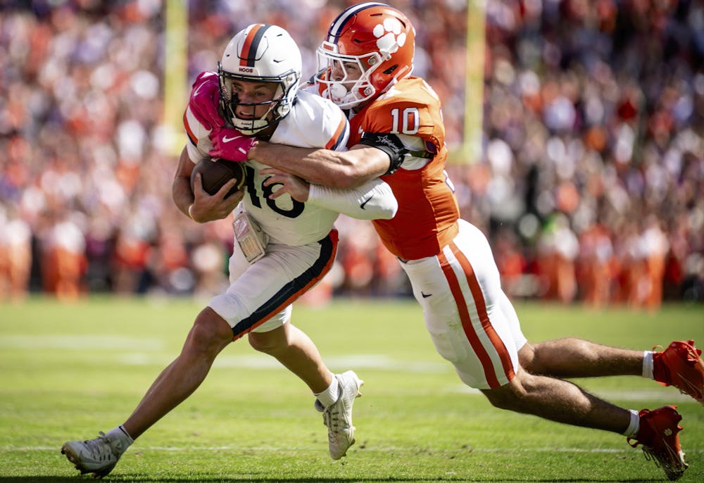 Sophomore quarterback Anthony Colandrea is tackled for a loss, attempting to escape the Tigers defense.