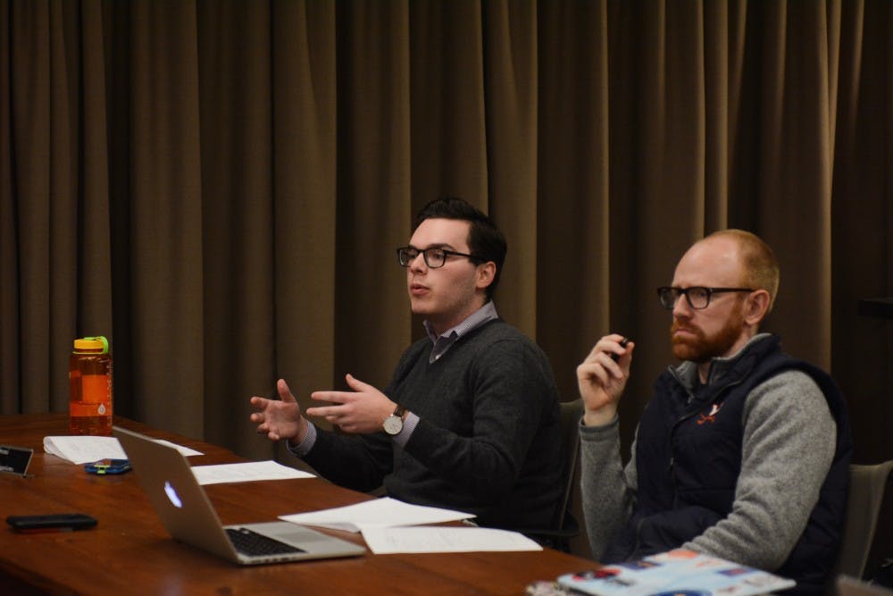 <p>Peyton Sandroni (left), a fourth-year Engineering student and vice chair for investigations, speaks at Sunday's meeting.&nbsp;</p>