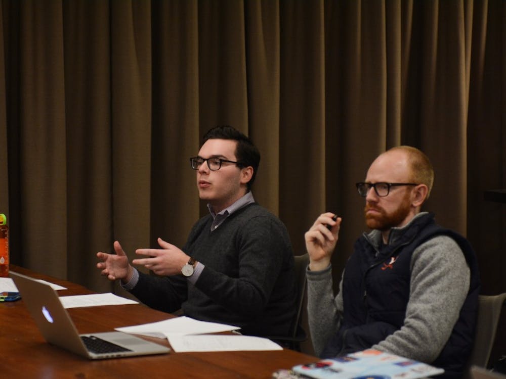 Peyton Sandroni (left), a fourth-year Engineering student and vice chair for investigations, speaks at Sunday's meeting. 