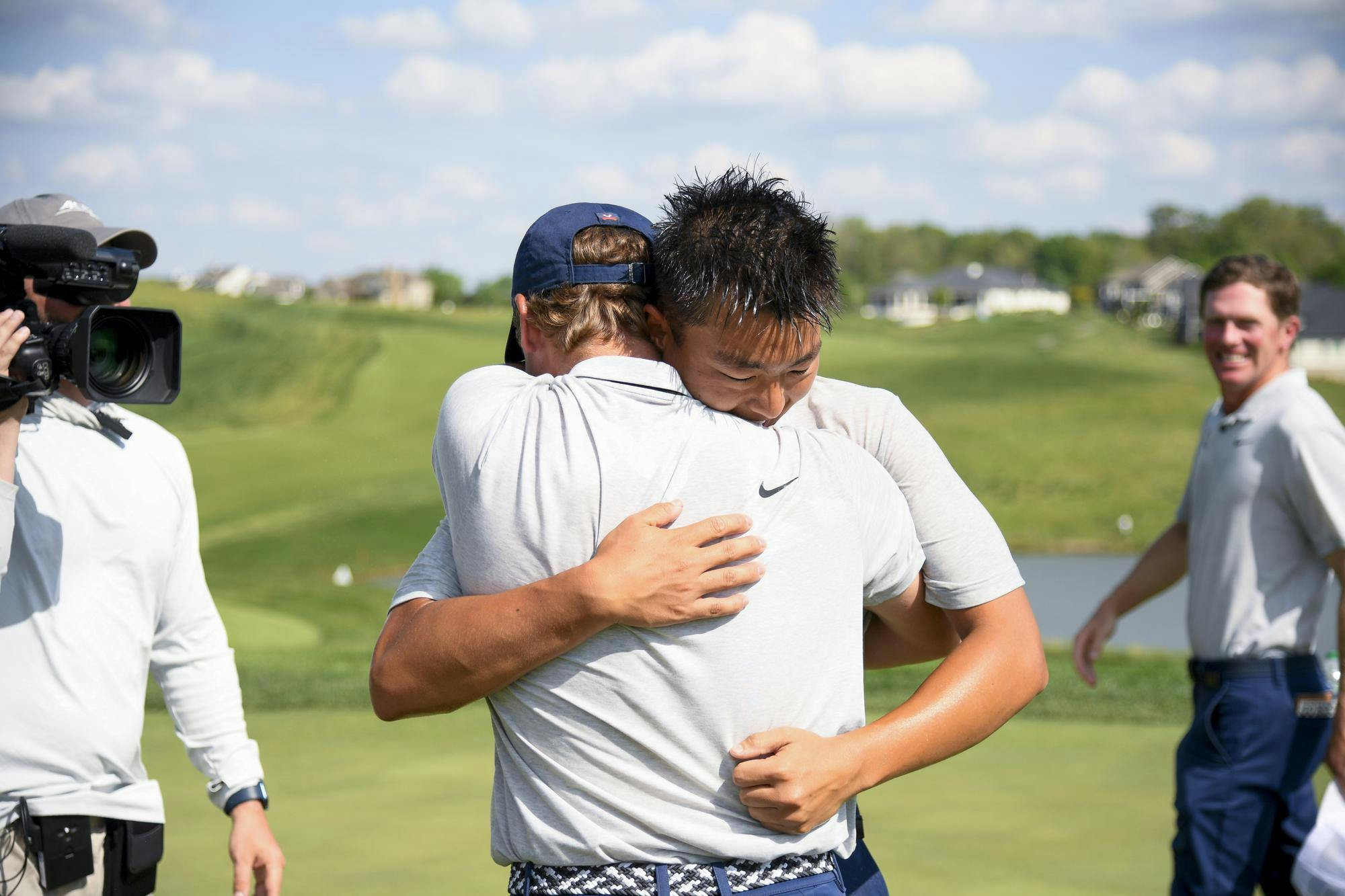 Water-soaked and giddy, Virginia celebrates after clinching the title.