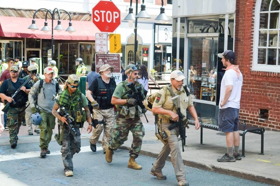 Heavily armed white nationalists march through the streets of&nbsp;downtown Charlottesville.