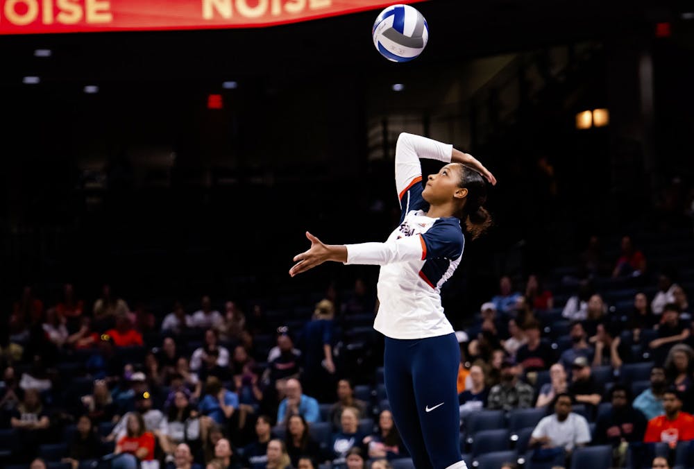 Milan Gomillion serves against Miami.