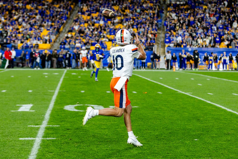 Sophomore quarterback Anthony Colandrea catches a pass from sophomore receiver Suderian Harrison.