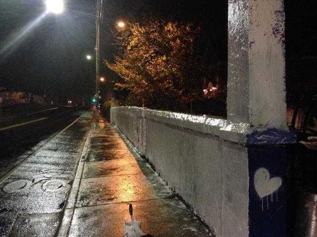 Students painted over Beta Bridge with white paint to allow other organizations to use the space.