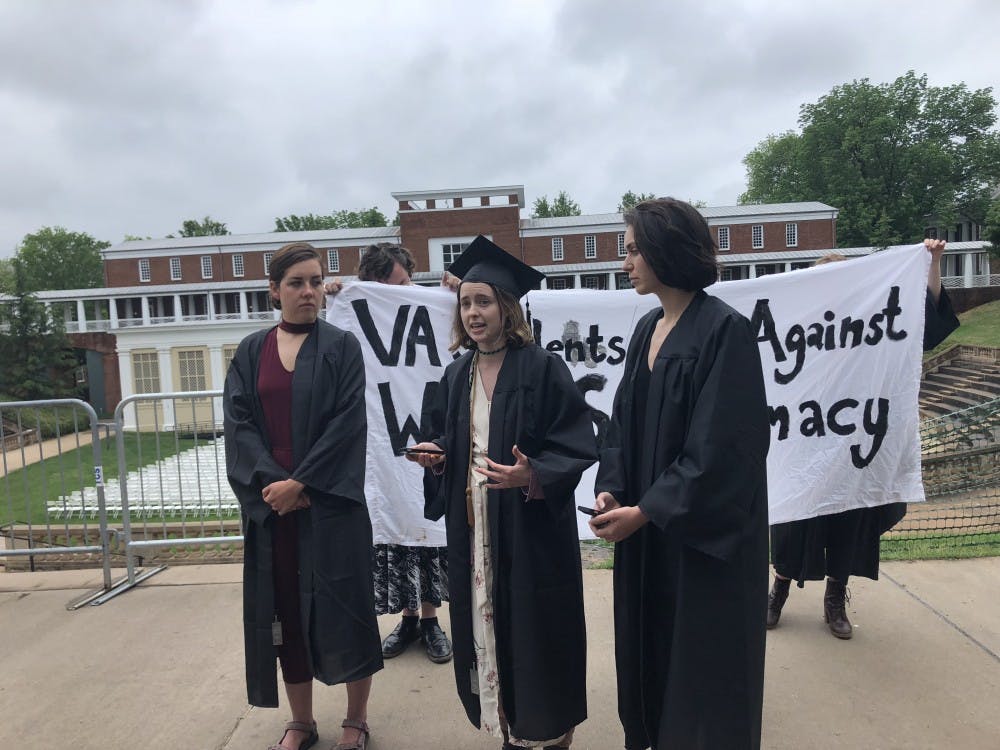 The three graduating students felt the University did not respond adequately to white supremacist rallies last August.