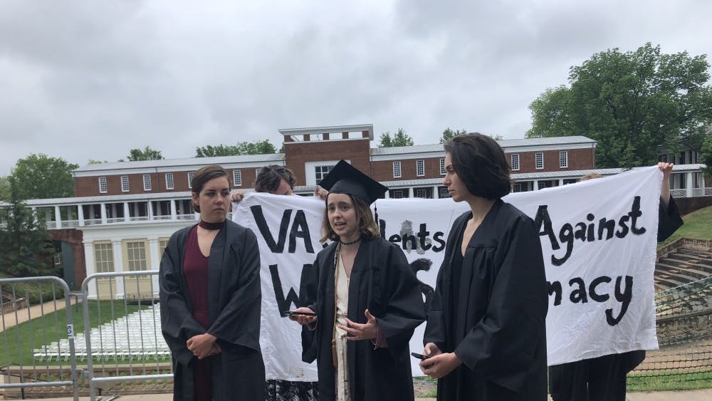 The three graduating students felt the University did not respond adequately to white supremacist rallies last August.
