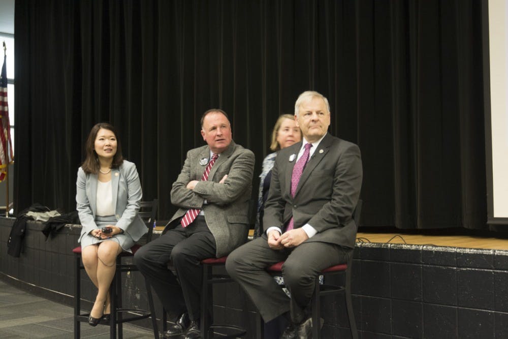 <p>Dr. Jennifer Lee, Del. David Toscano and Sen. Creigh Deeds at the town hall Tuesday evening.</p>