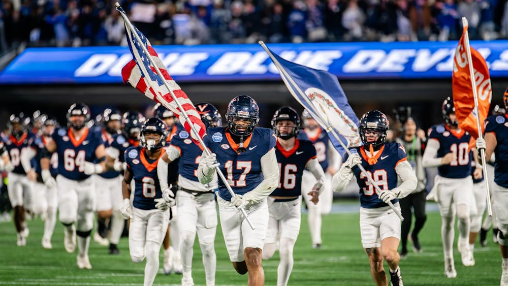The Cavaliers take the field at the ACC Championship game.