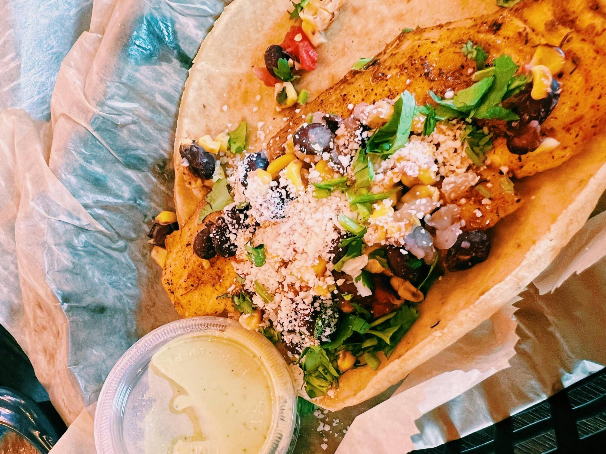 These tacos came with bursting flavor, a fresh lime slice and a delicious green sauce to add to taste.&nbsp;