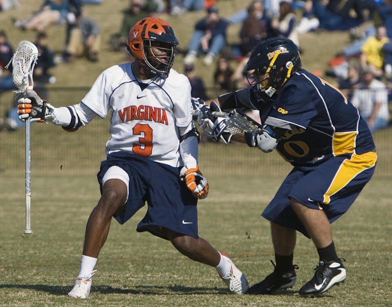 Virginia Cavaliers M Rhamel Bratton (3) is defended by Drexel Dragson M Andrew Collins (10).  The #2 ranked Virginia Cavaliers defeated the Drexel Dragons 13-7 at the University of Virginia's Klockner Stadium in Charlottesville, VA on February 14, 2009.