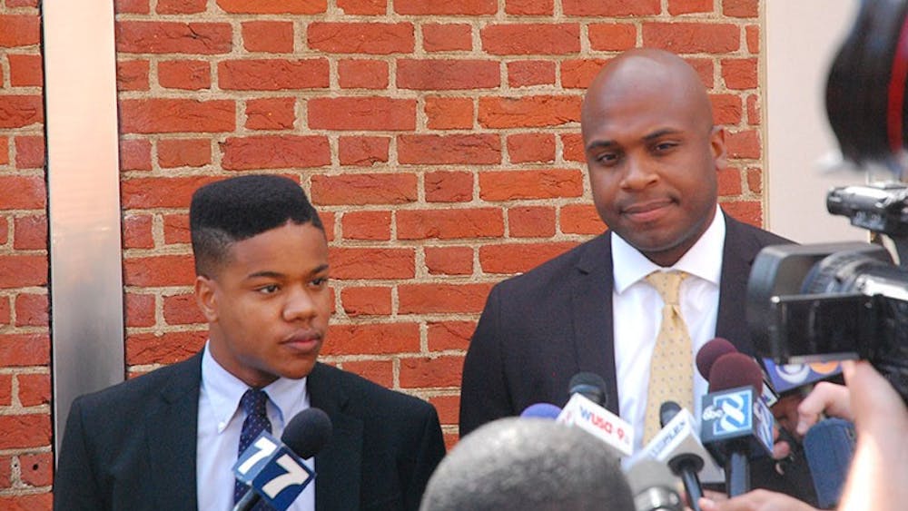 Martese Johnson and his lawyer, Daniel Watkins, speak to press.