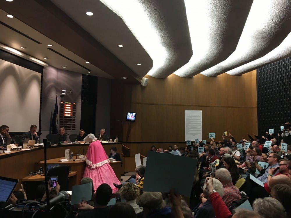 A community member dressed in Civil War garb argues that the Confederate statue should stay in Lee Park.&nbsp;