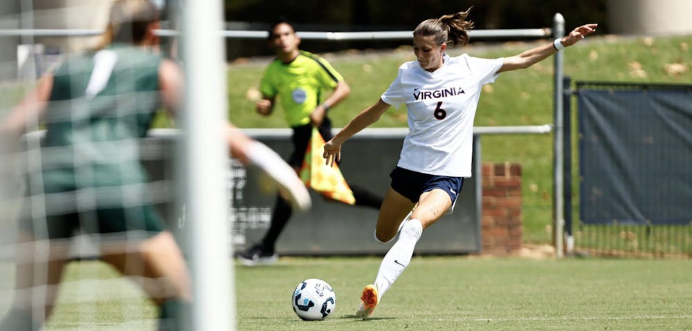 <p>Senior forward Degen Miller crosses the ball into the box Sunday afternoon against Northwestern.</p>