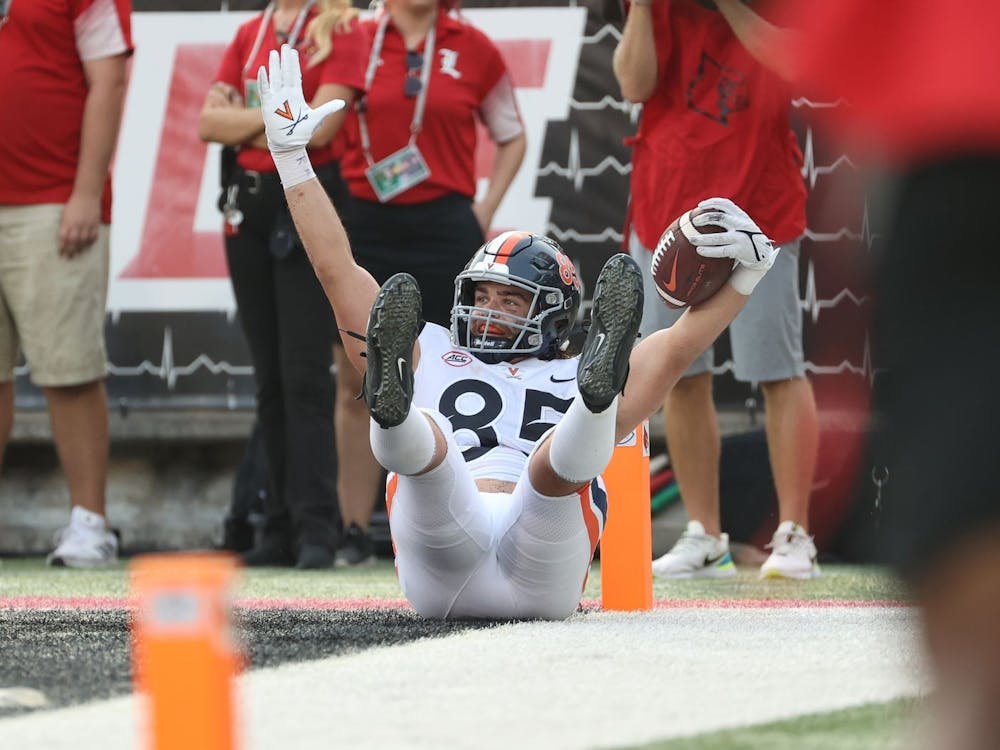 Virginia junior tight end Grant Misch celebrates after scoring the game-winning touchdown with less than 30 seconds remaining against Louisville Saturday afternoon.