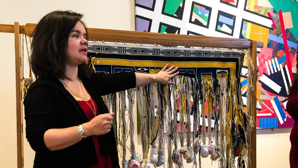 Artist Lily Hope demonstrates the craft of Chilkat weaving at the Fralin.