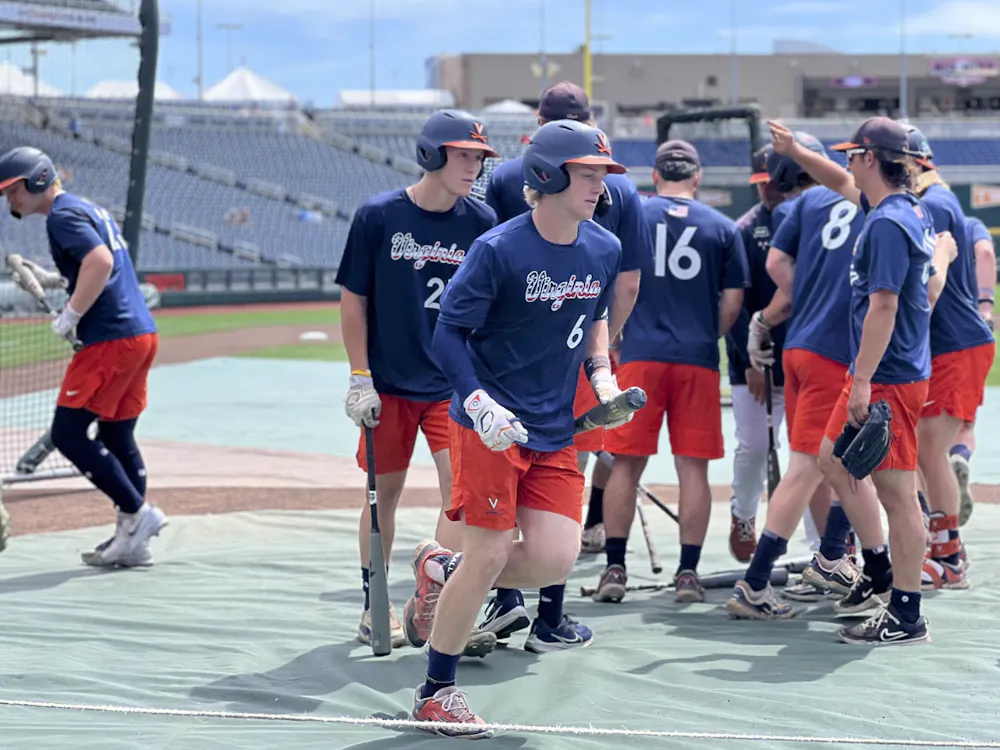 The Cavaliers disperse to begin warming up for their Friday afternoon game against the Tar Heels.