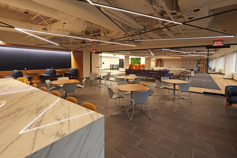 <p>The new 55,000-square-foot facility, located at the Inova Center for Personalized Health, includes six classrooms as well as various multi-purpose rooms, quiet study areas and a café, with interiors decorated in orange and blue and murals featuring Charlottesville landmarks.</p>