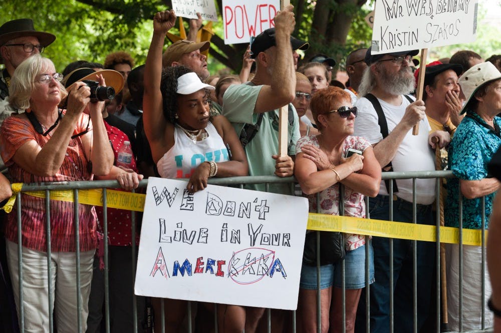 Local protesters&nbsp;standing in defiance of the KKK rally on July 8.