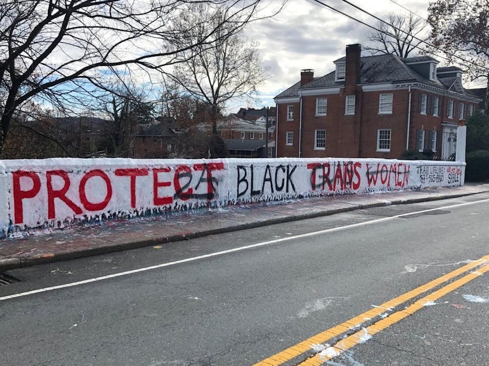 A few weeks after the original message was painted, it was defaced with scrawls of pro-gun rhetoric in an act of violent hate speech against the transgender community.
