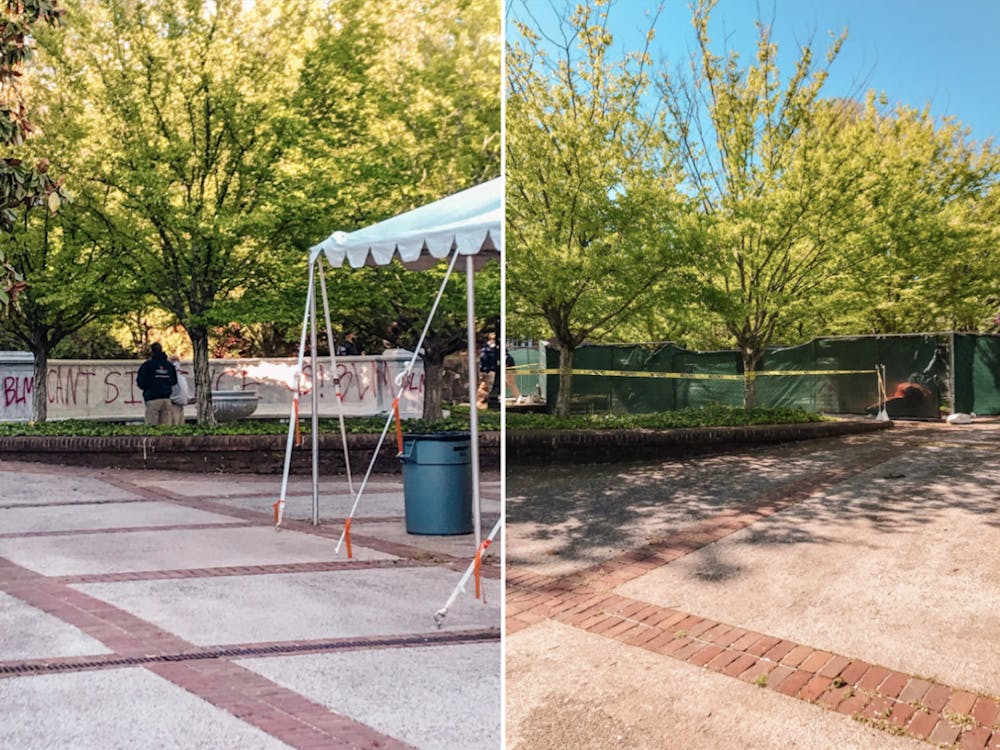 The memorial was covered in red spray paint reading "You can't silence us" and "BLM" and has since been closed off with fences and tarps. 