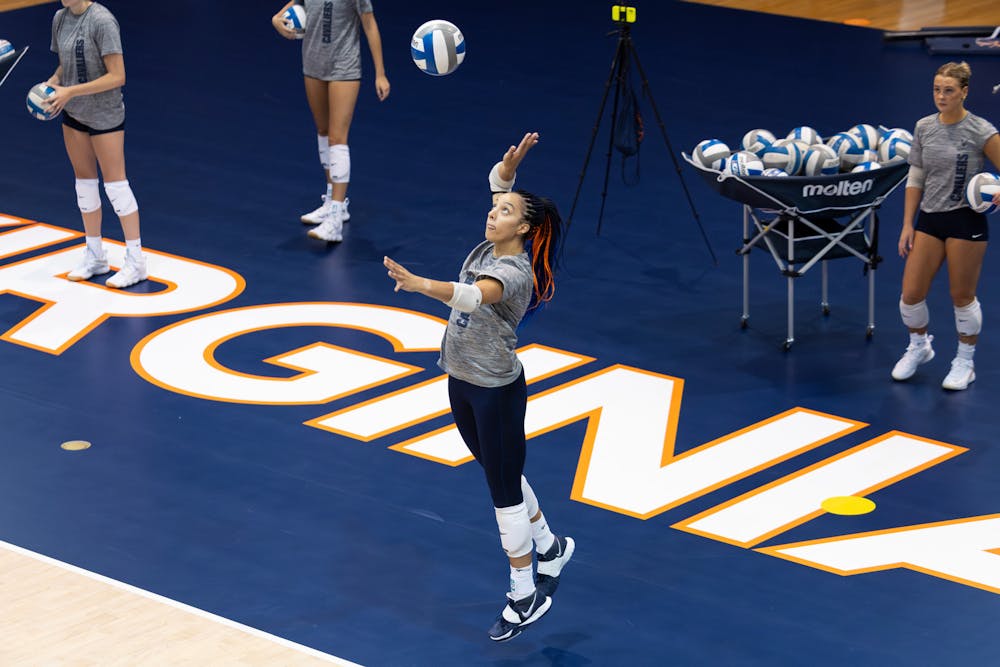 <p>Duprey gets set to serve during a Virginia volleyball practice.</p>