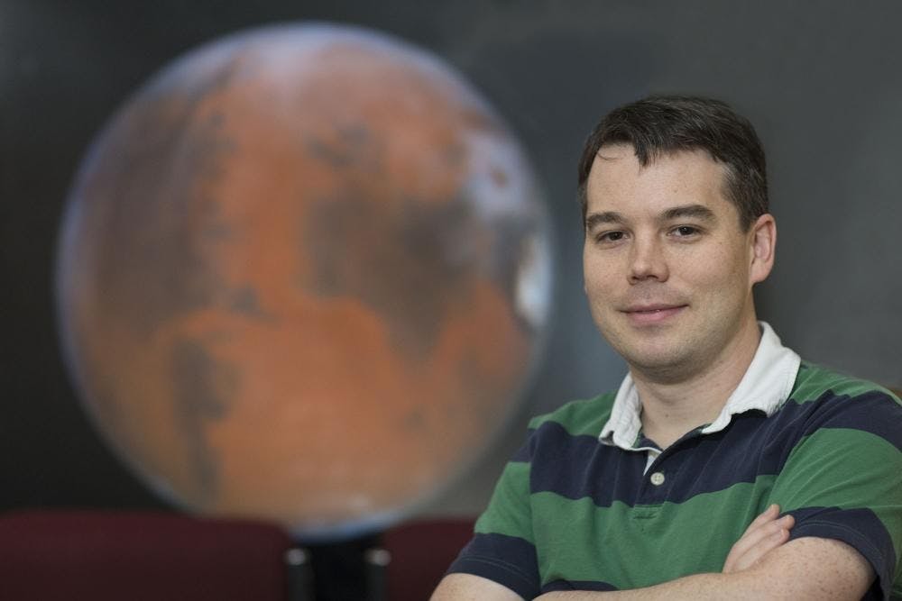Asst. Prof. of astronomy Shane Davis studies the growth of black holes and stars, recently collaborating with a Harvard University researcher and an NSF supercomputer.