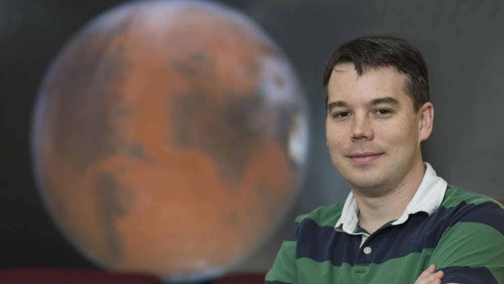 Asst. Prof. of astronomy Shane Davis studies the growth of black holes and stars, recently collaborating with a Harvard University researcher and an NSF supercomputer.