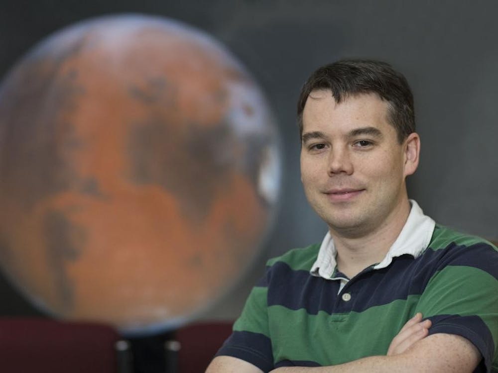 Asst. Prof. of astronomy Shane Davis studies the growth of black holes and stars, recently collaborating with a Harvard University researcher and an NSF supercomputer.