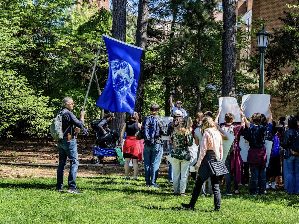 The rally began on the North side of the Rotunda from which around thirty people, including University students as well as Charlottesville community members, marched to the Corner next to the University heating plant off West Main Street.